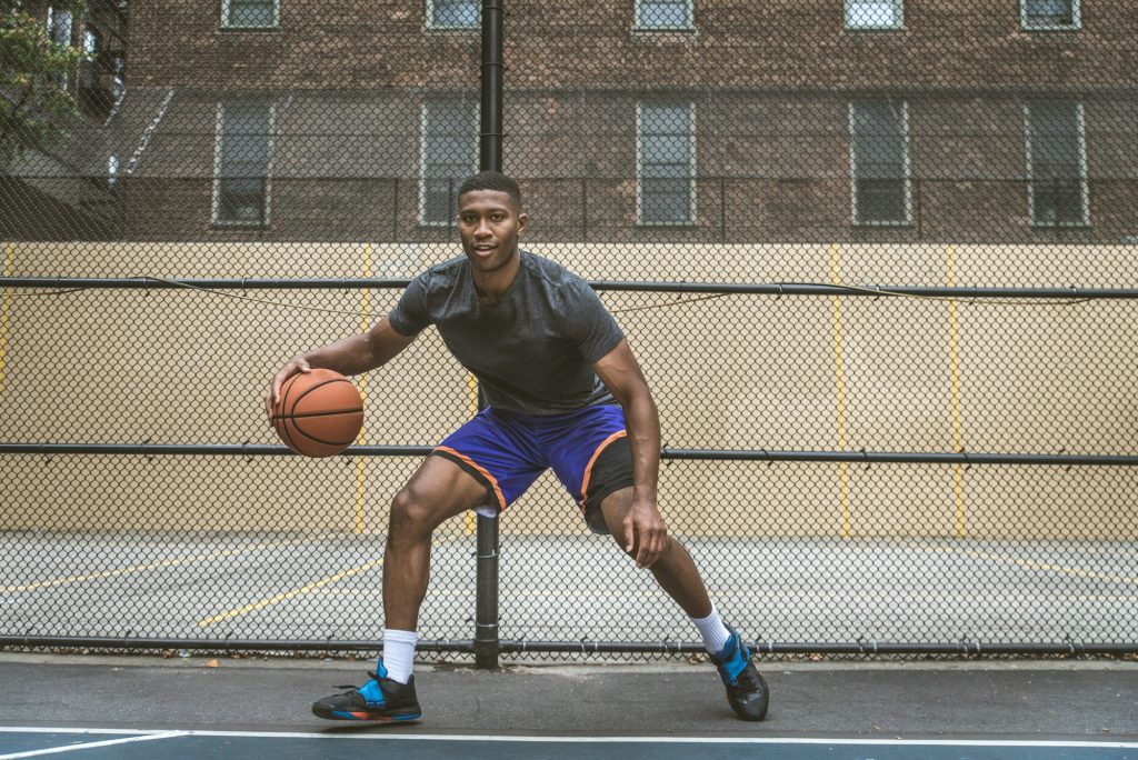 Basketball player training outdoors