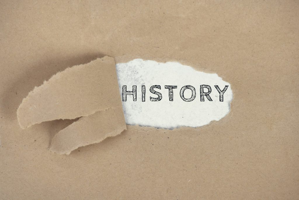 The word History on a ripped paper