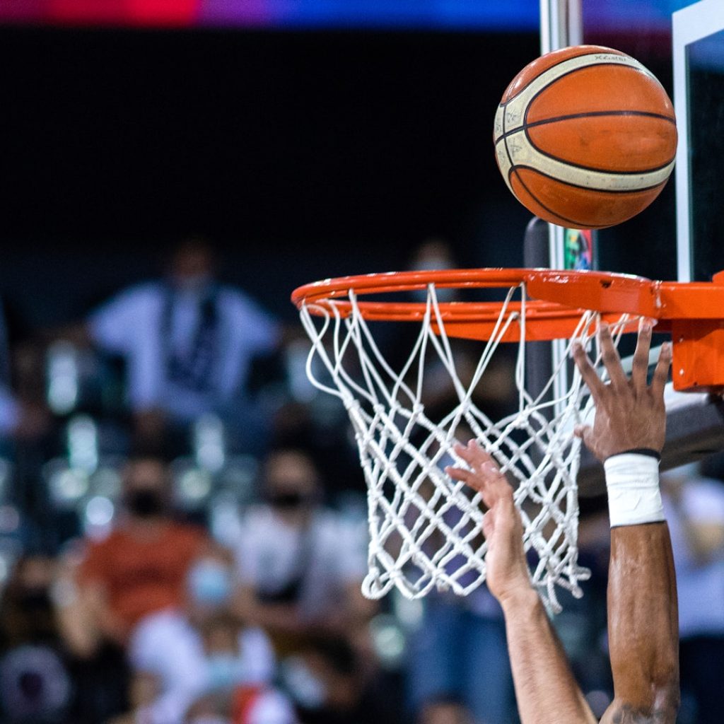 basketball going through hoop during game