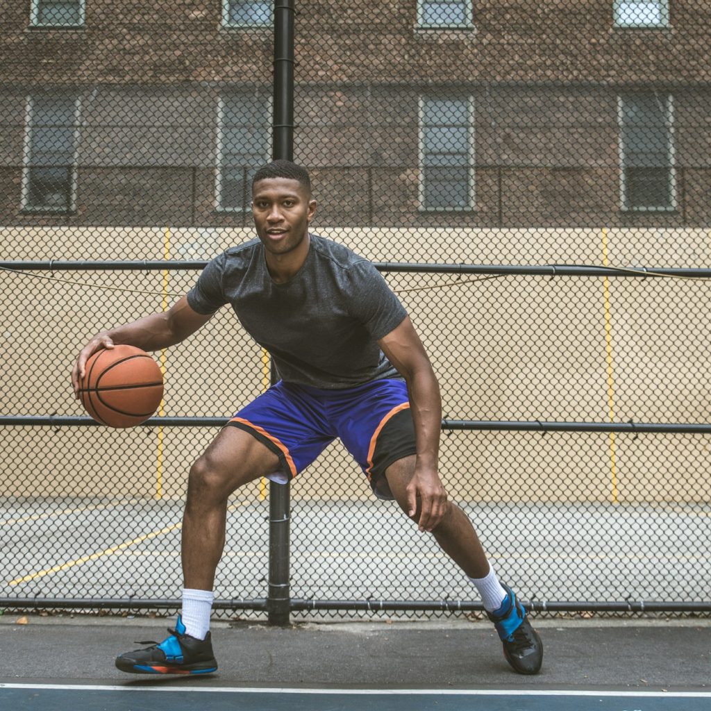 Basketball player training outdoors